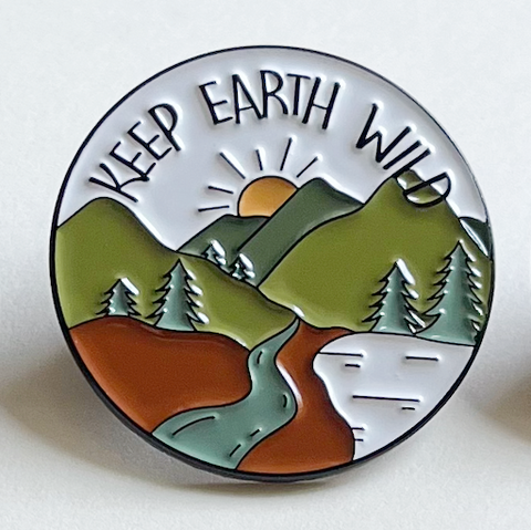 Camping Pin with Green Mountains, Trees, River, and Sky Scene with Saying "Keep Earth Wild"