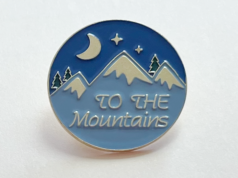 Camping Pin with Mountains, Pine Trees, Moon, and Blue Night Sky Scene with Saying "To The Mountains"