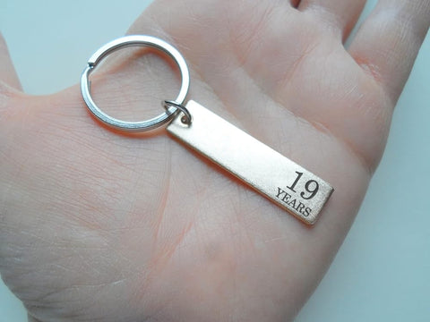 19 Year Anniversary Gift • Small Bronze Tag Keychain Engraved with "19 Years"