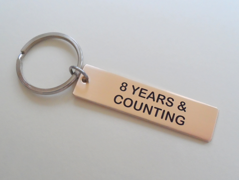 8 Year Anniversary Gift - Bronze Tag Keychain Engraved with "8 Years & Counting" by Jewelry Everyday