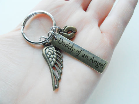Bronze Memorial Keychain with Daddy of an Angel Tag, Baby Feet & Wing Charm by JewelryEveryday