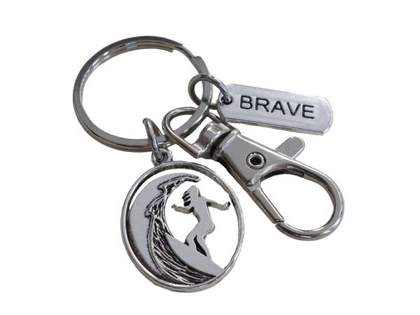 Surfing Keychain with a Girl Surfer Charm, Brave Charm, and Swivel Clasp