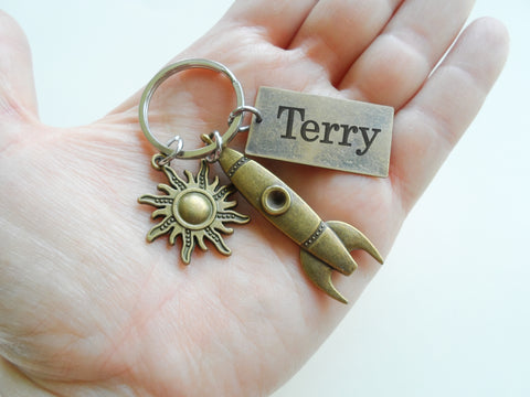 Bronze Rocket Ship Charm Keychain with Sun Charm & Custom Engraved Tag by JewelryEveryday