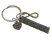 An antique bronze keychain featuring a rectangular bar engraved with tally marks, a small heart charm engraved with 'I love you', and an infinity symbol, attached to a silver split ring on a light background.