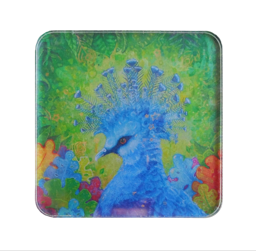 A square magnet with rounded corners featuring a colorful artistic illustration of a blue peacock against a green and yellow background.