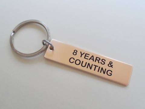 8 Year Anniversary Gift • Bronze Tag Keychain Engraved w/ "8 Years & Counting" by Jewelry Everyday